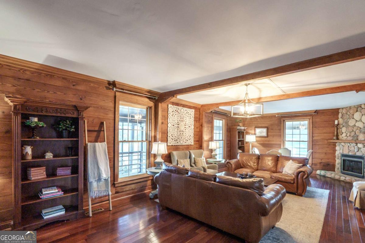 7527 Highway 326 Commerce, GA 30530 - Photo 28 of 100 a living room with furniture and large windows