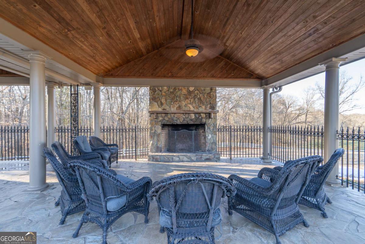 7527 Highway 326 Commerce, GA 30530 - Photo 67 of 100 a living room with furniture and a fireplace