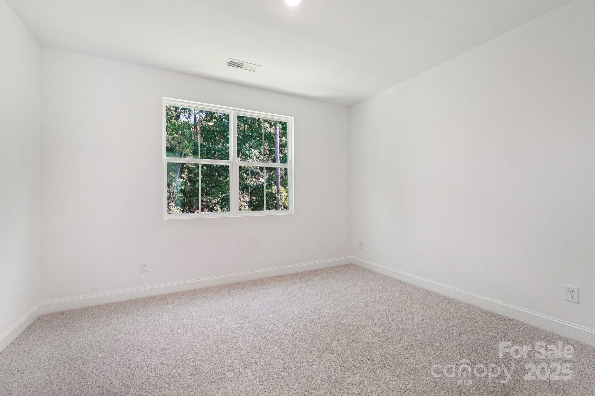 620 Mercury Drive Tega Cay, SC 29708 - Photo 14 of 16 an empty room with a window