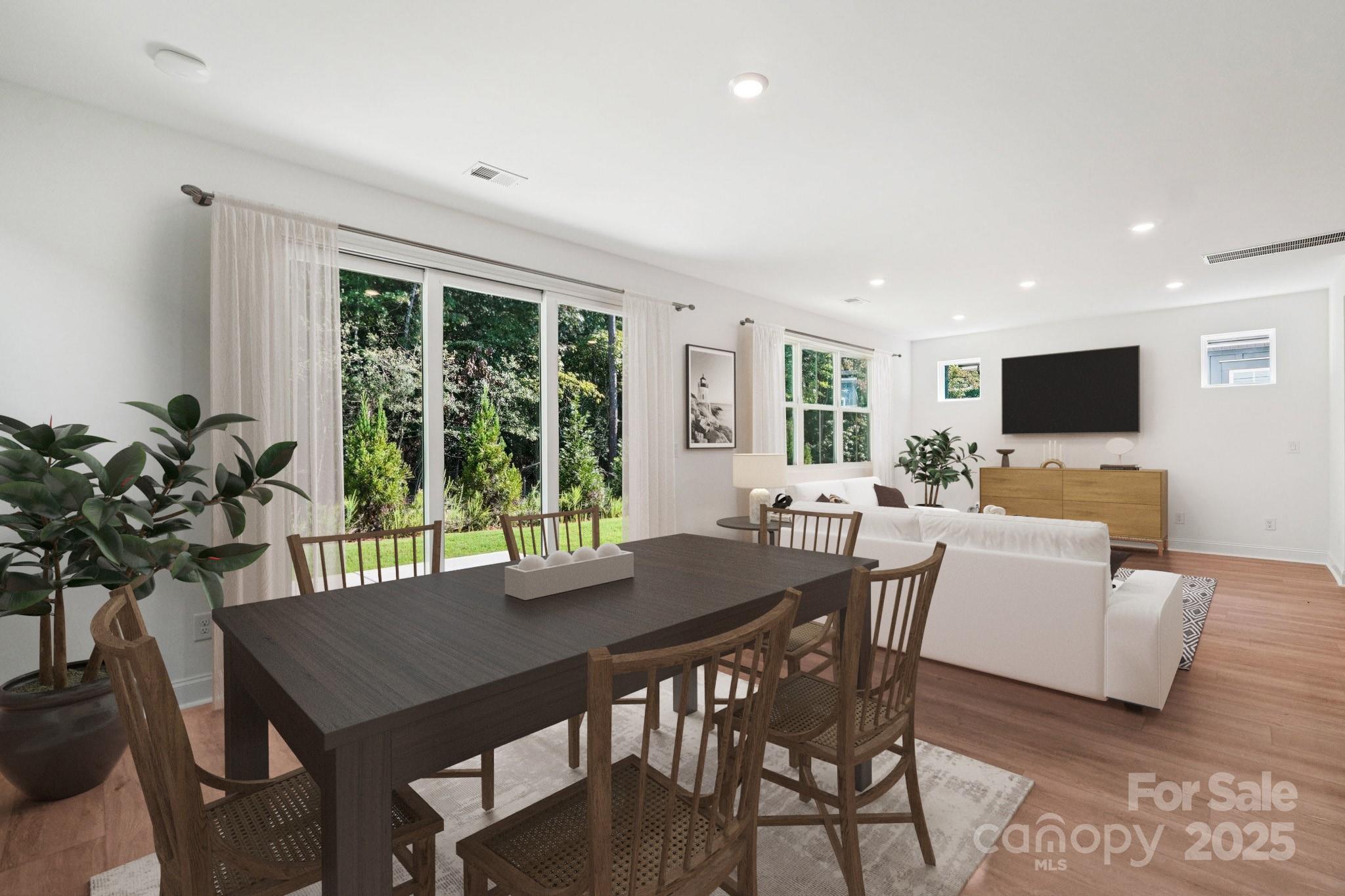 620 Mercury Drive Tega Cay, SC 29708 - Photo 6 of 16 a view of a dining room with furniture window and outside view
