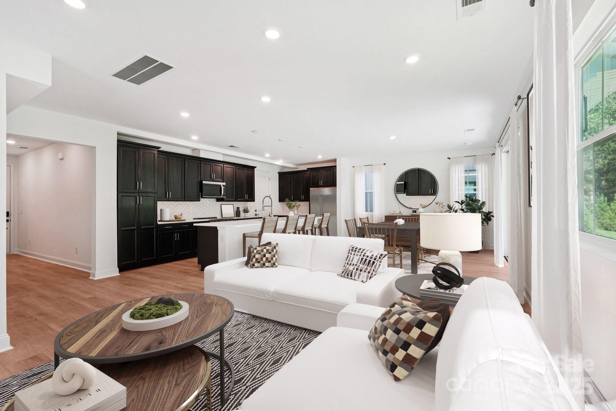 620 Mercury Drive Tega Cay, SC 29708 - Photo 7 of 16 a living room with furniture and a view of kitchen