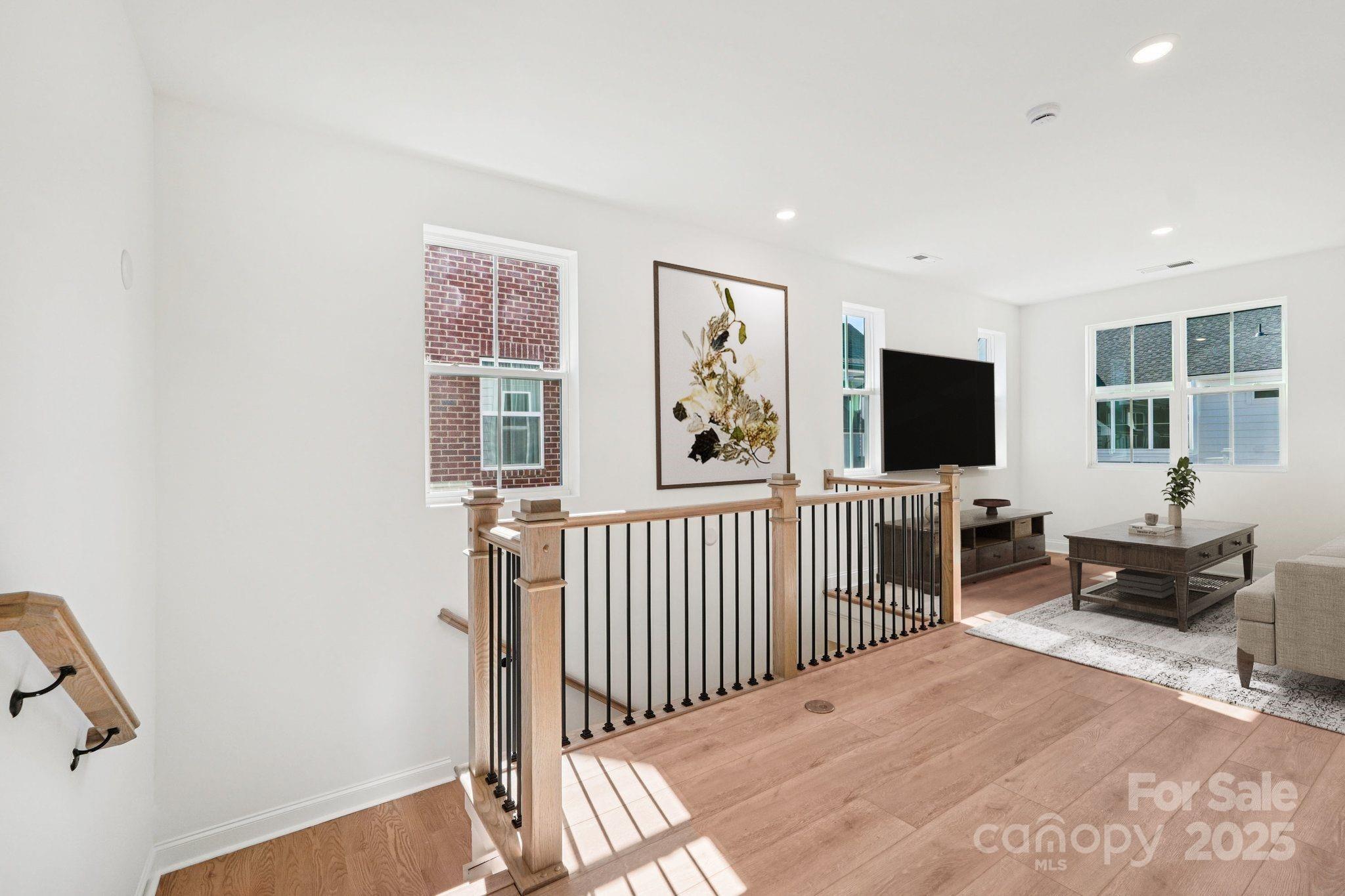 620 Mercury Drive Tega Cay, SC 29708 - Photo 8 of 16 a view of a livingroom with furniture and windows