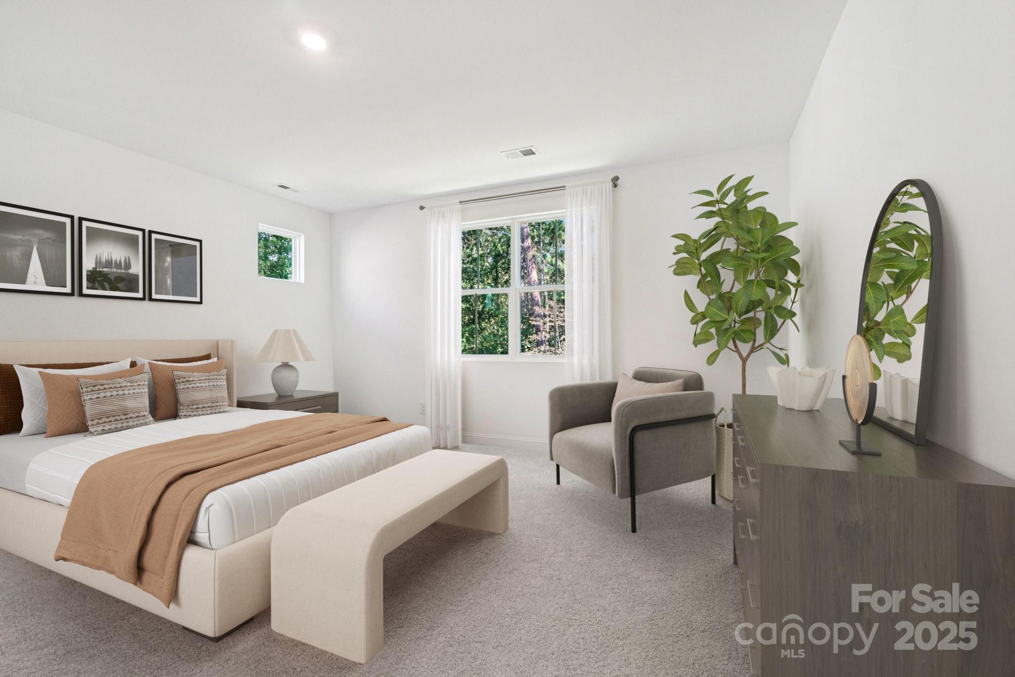 620 Mercury Drive Tega Cay, SC 29708 - Photo 10 of 16 a bedroom with bed and a couch