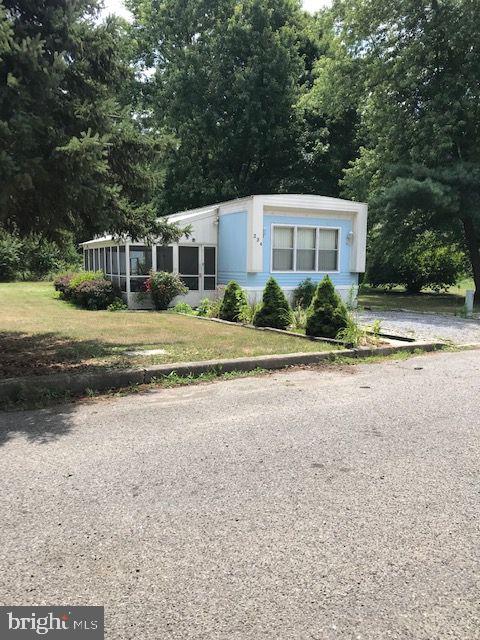 46 Jones Mill Road Wrightstown, NJ 08562 - Photo 1 of 34 a front view of a house with a yard and garage