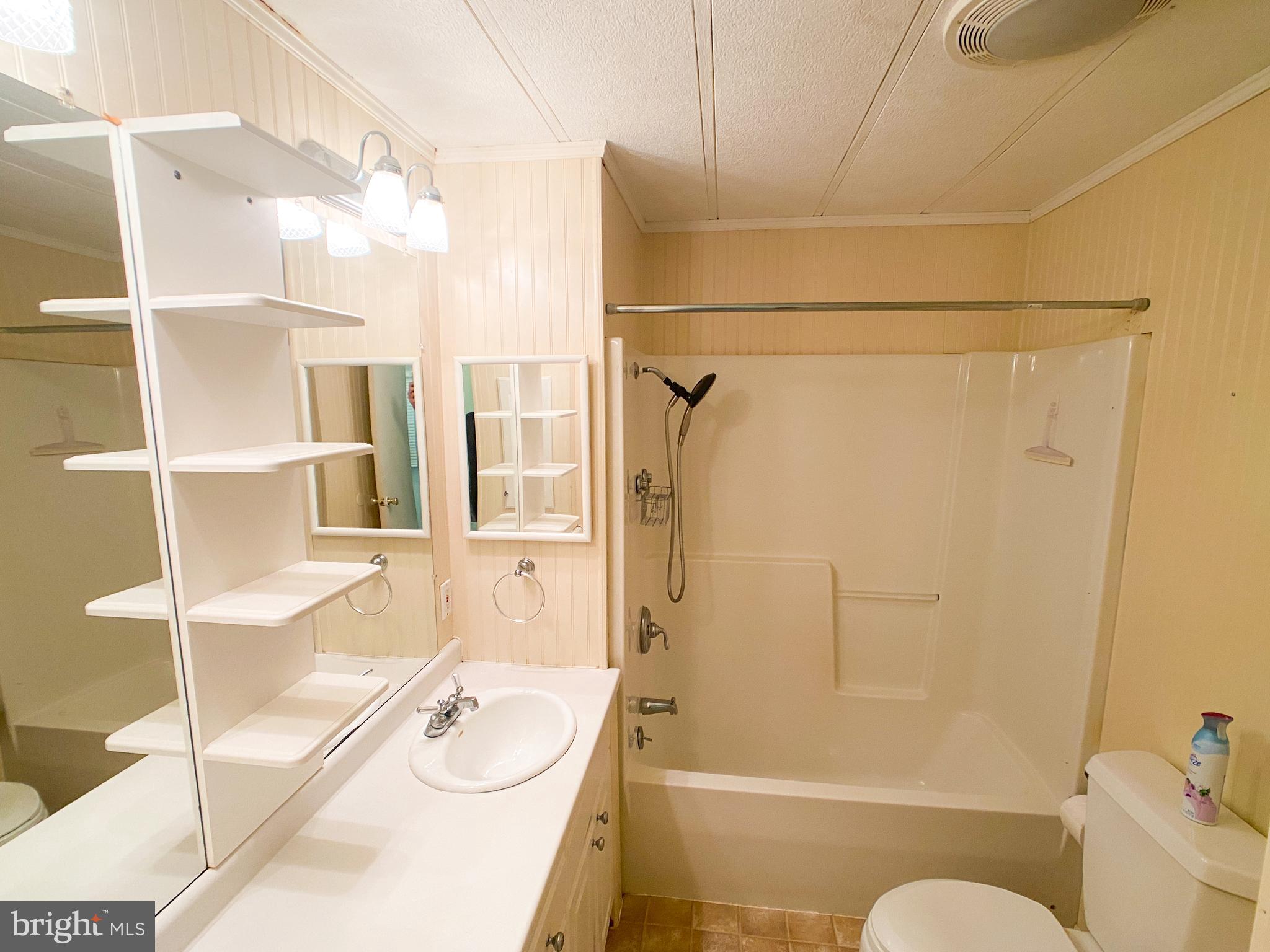 46 Jones Mill Road Wrightstown, NJ 08562 - Photo 14 of 34 a bathroom with a granite countertop bathtub shower sink and toilet