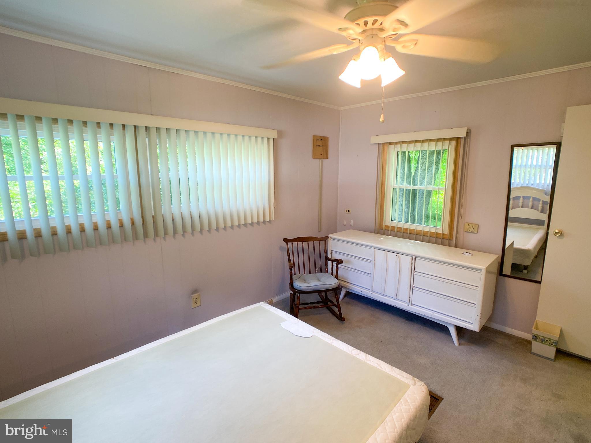 46 Jones Mill Road Wrightstown, NJ 08562 - Photo 23 of 34 a bedroom with a bed and a window
