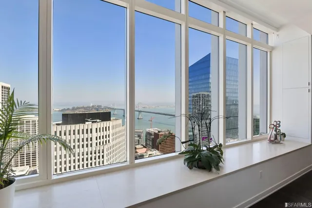 a spacious bedroom with a bed and a window