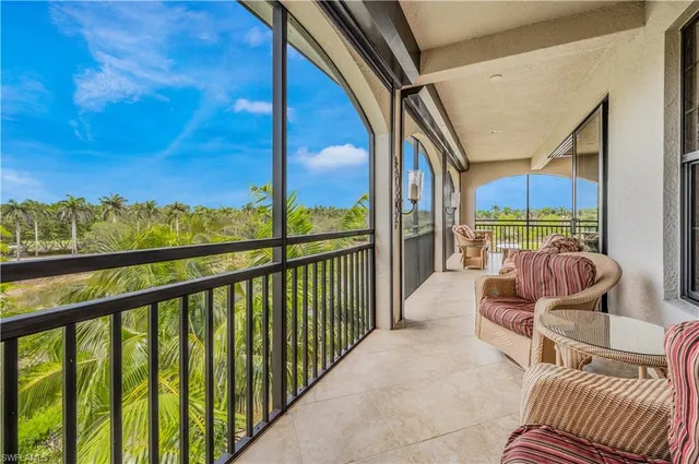 a view of balcony with furniture