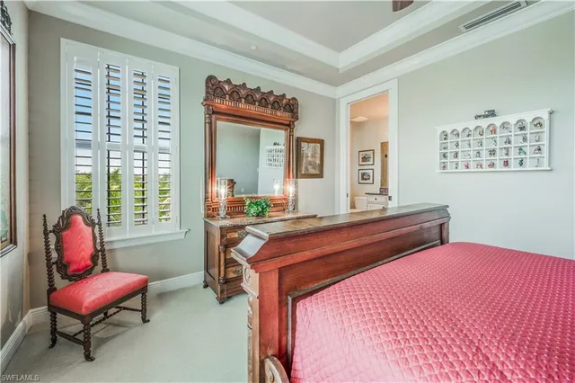 a room with a bed and furniture