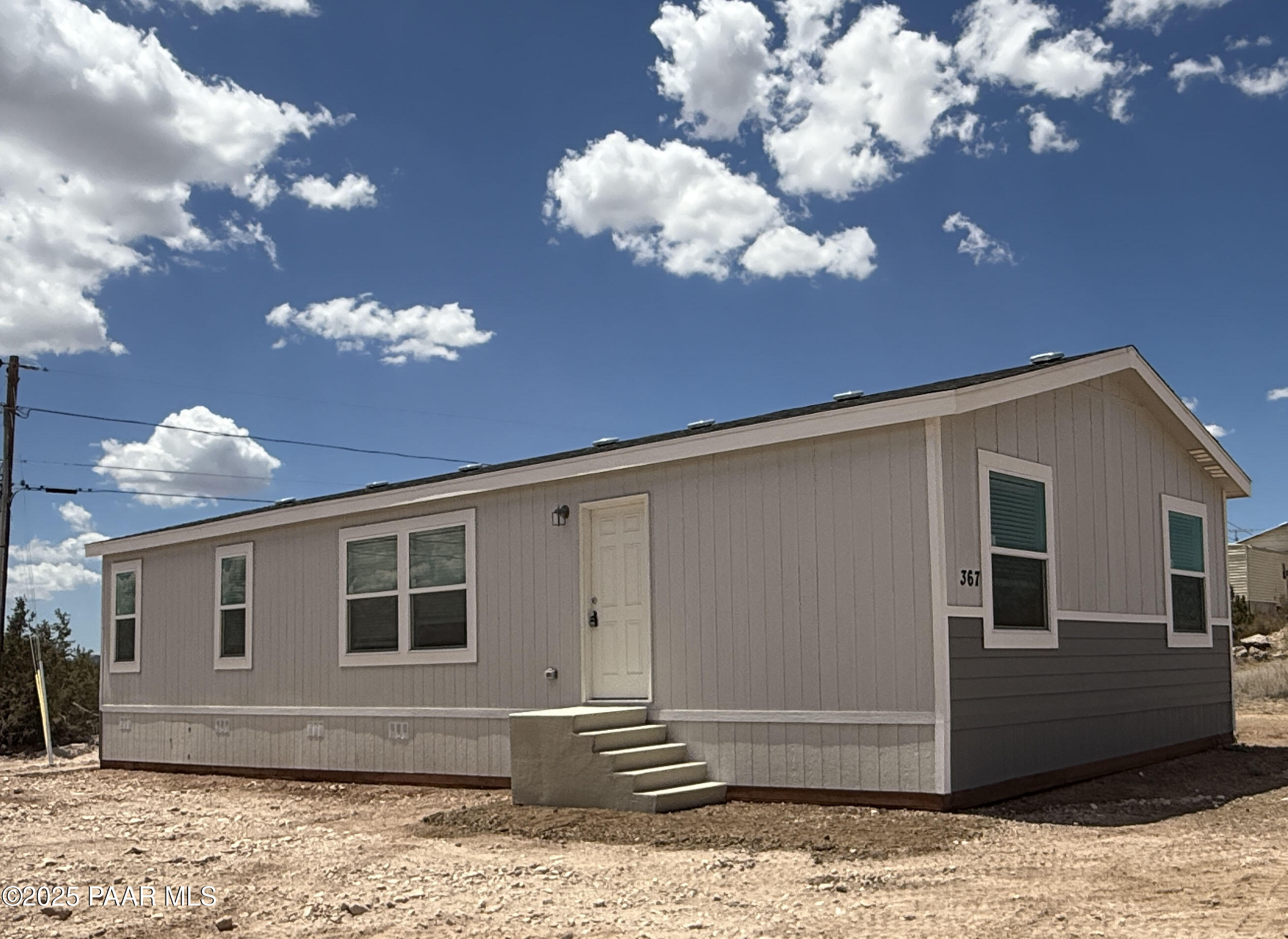 375 Antelope Run Road Paulden, AZ 86334 - Photo 2 of 17 a view of a house with a large tree