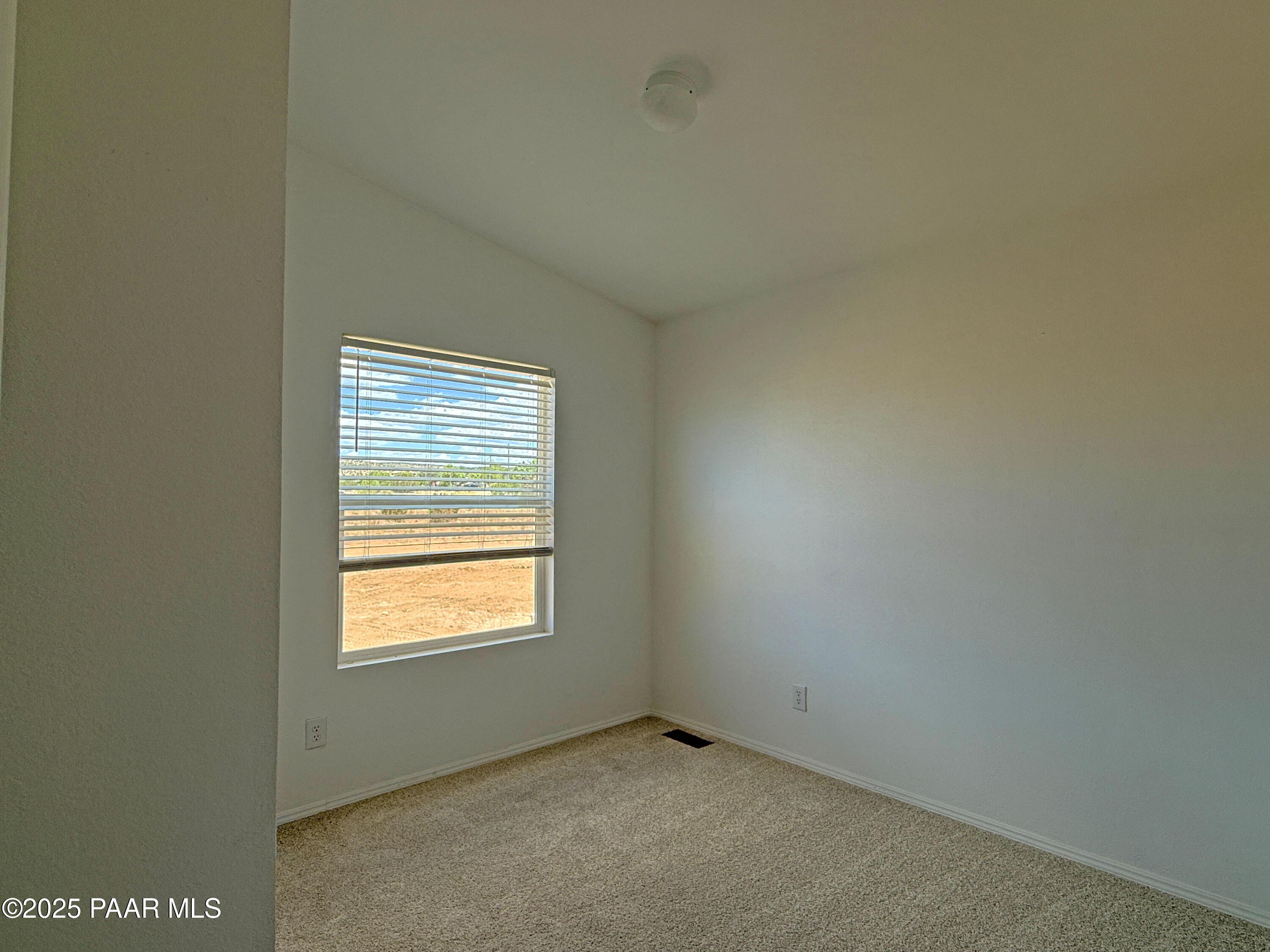 375 Antelope Run Road Paulden, AZ 86334 - Photo 4 of 17 a view of an empty room with a window