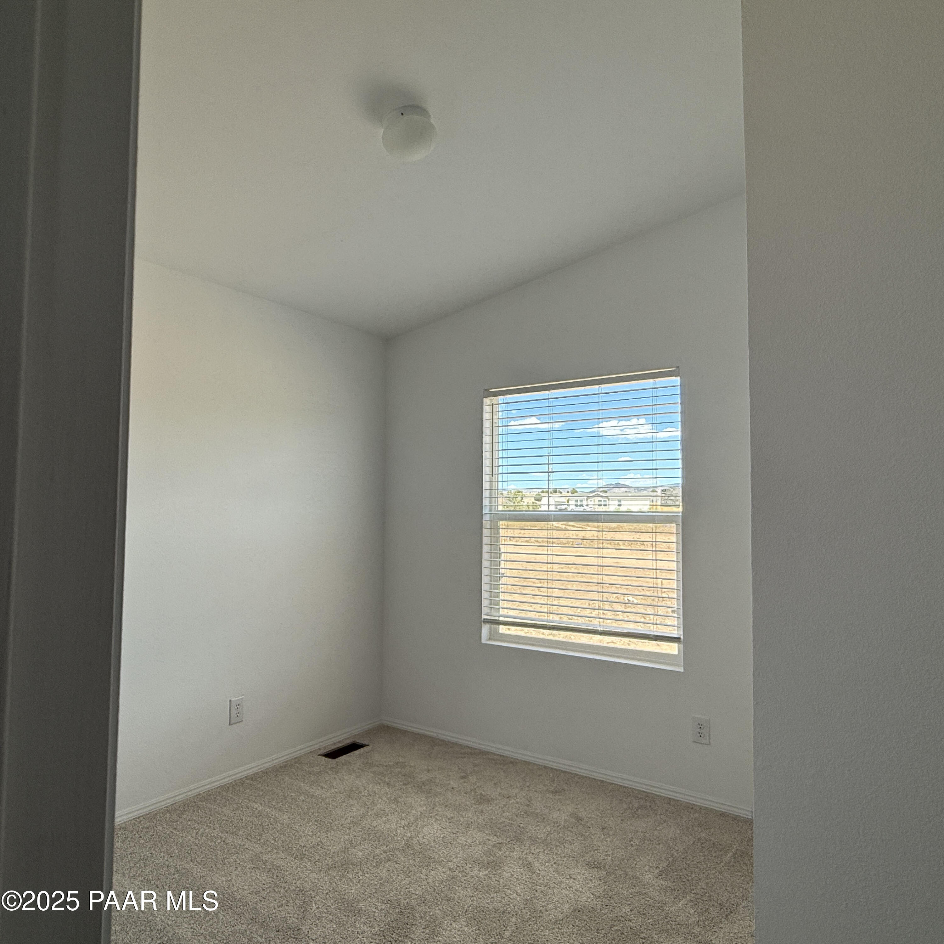 375 Antelope Run Road Paulden, AZ 86334 - Photo 6 of 17 a view of an empty room with a window