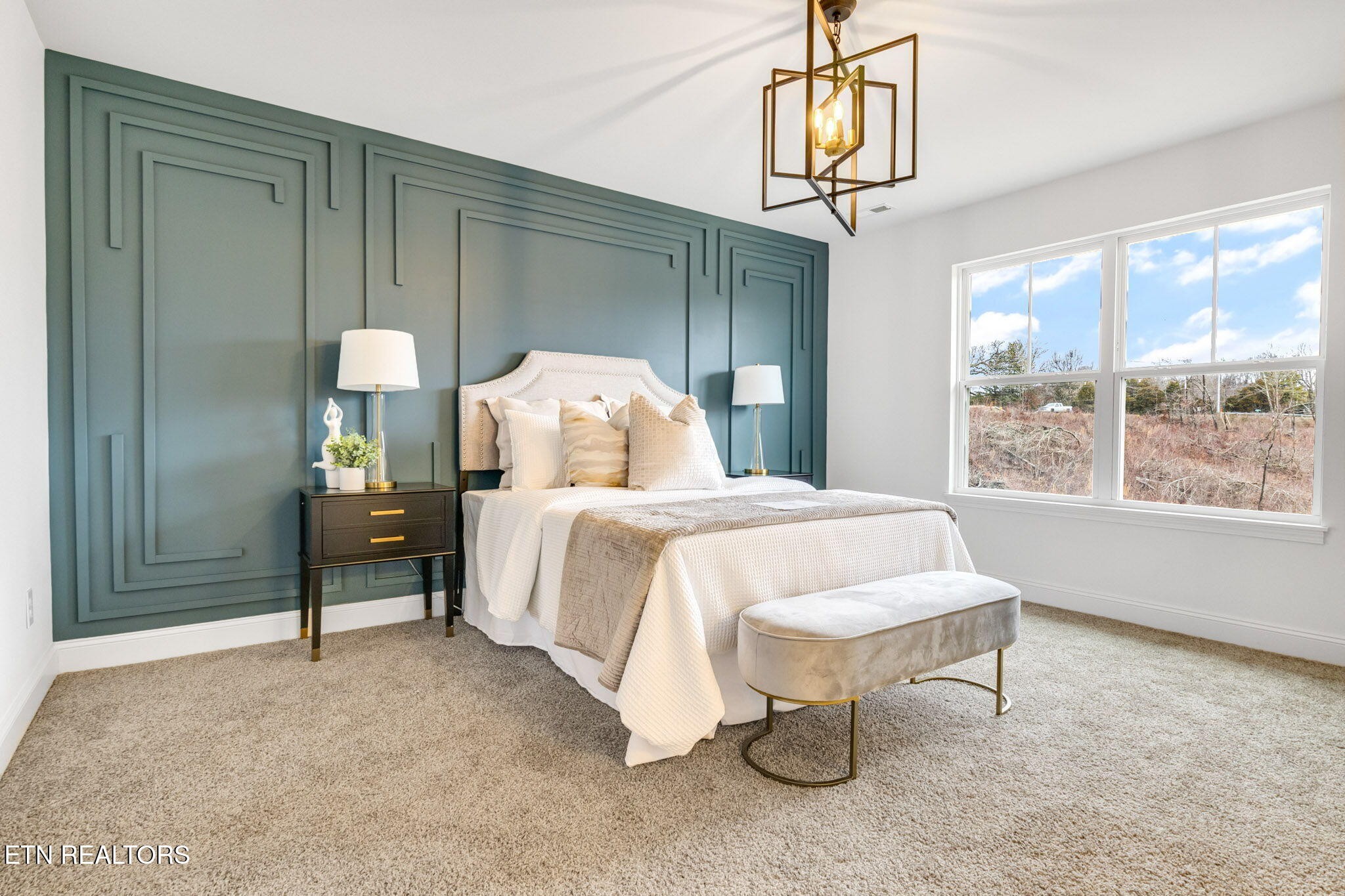 8418 Whisper Lane Powell, TN 37849 - Photo 19 of 42 a bedroom with a bed and a table