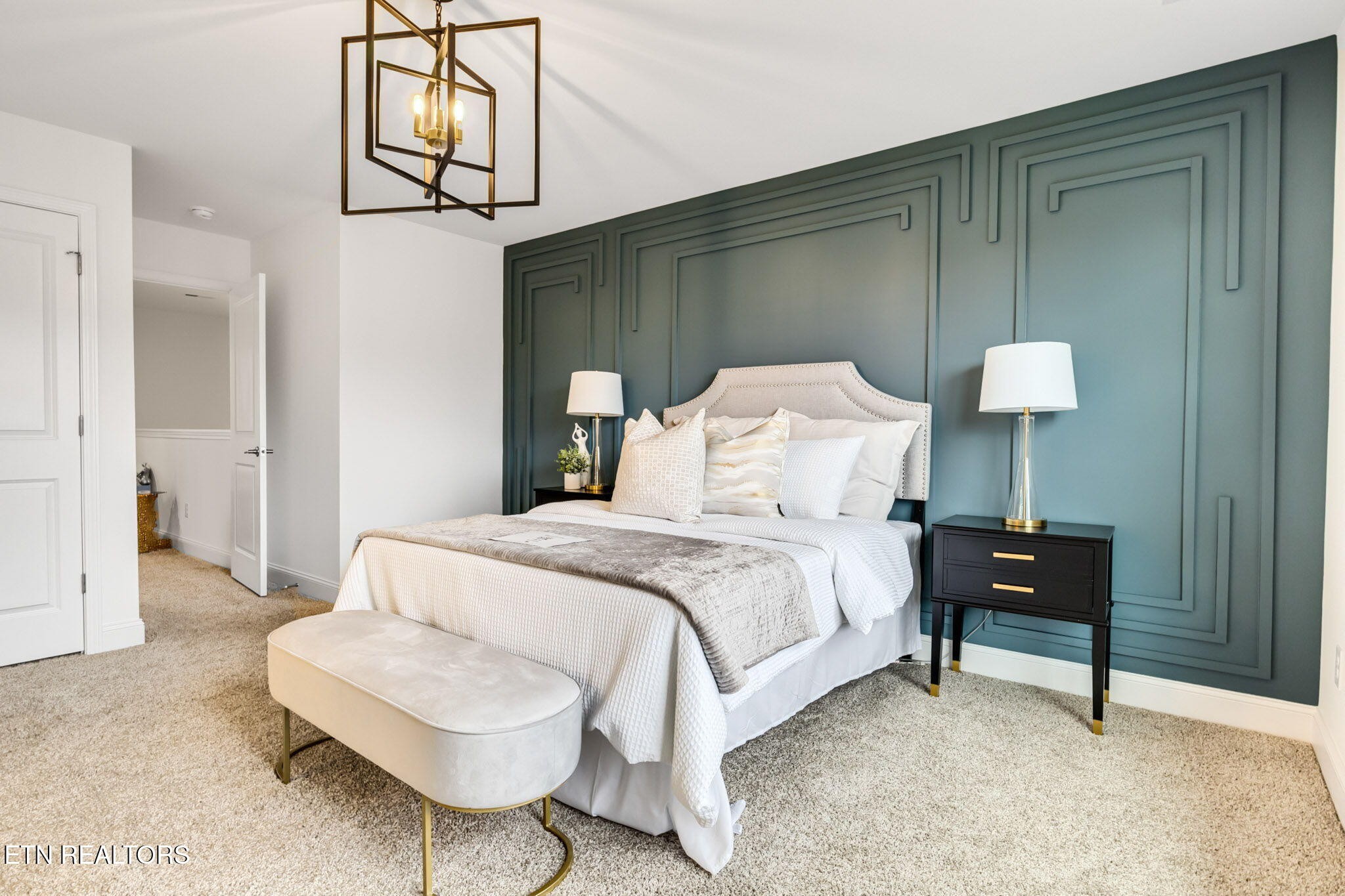 8418 Whisper Lane Powell, TN 37849 - Photo 21 of 42 a bedroom with a bed a chair and potted plant on the table