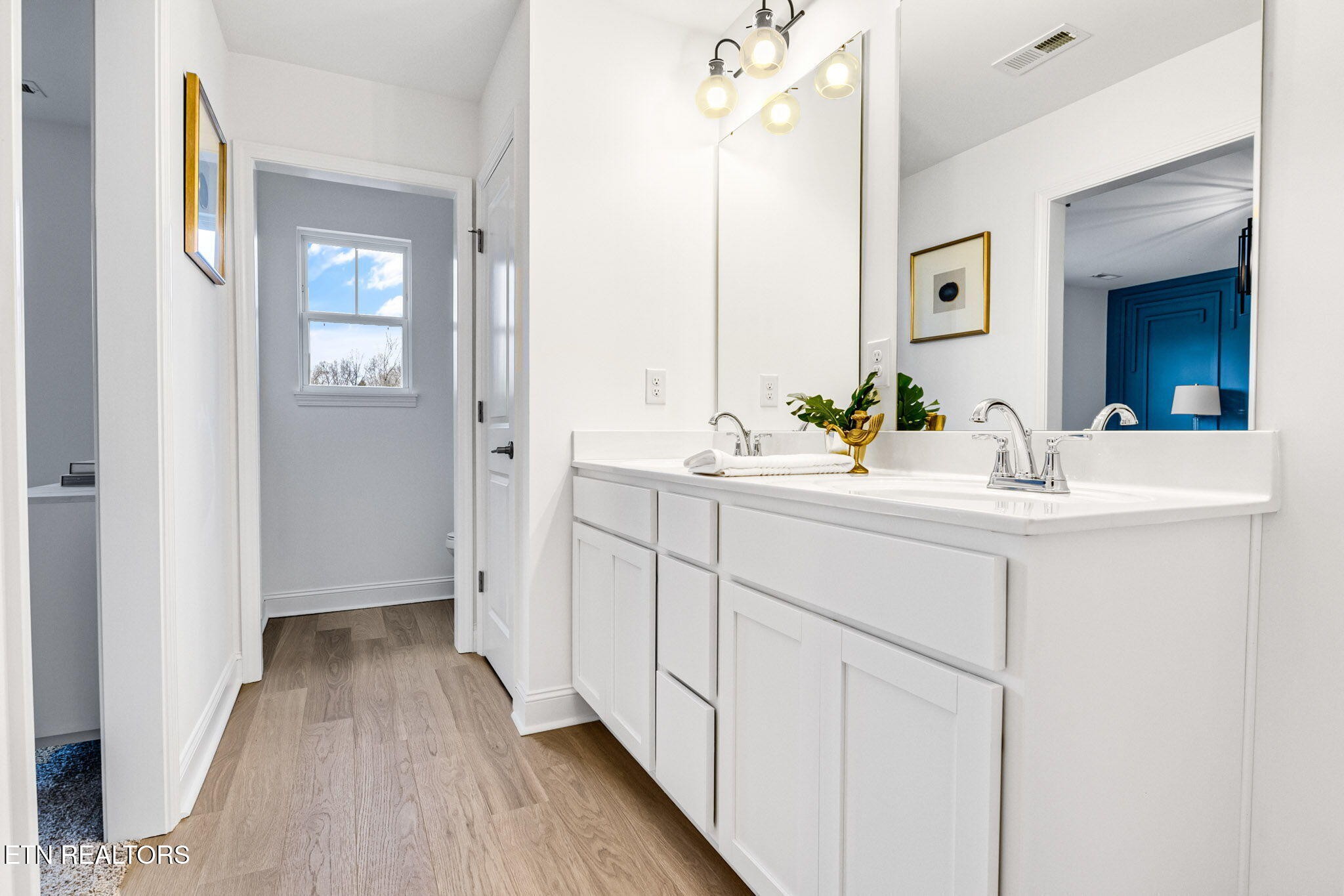 8418 Whisper Lane Powell, TN 37849 - Photo 22 of 42 a bathroom with a sink and mirror