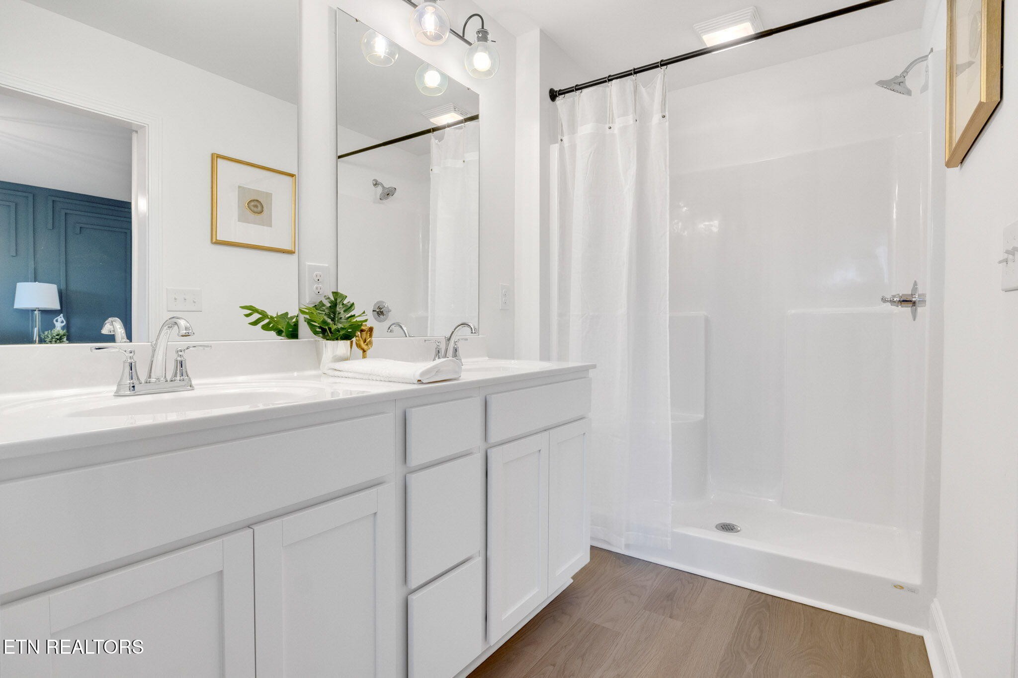 8418 Whisper Lane Powell, TN 37849 - Photo 23 of 42 a bathroom with a sink and a mirror