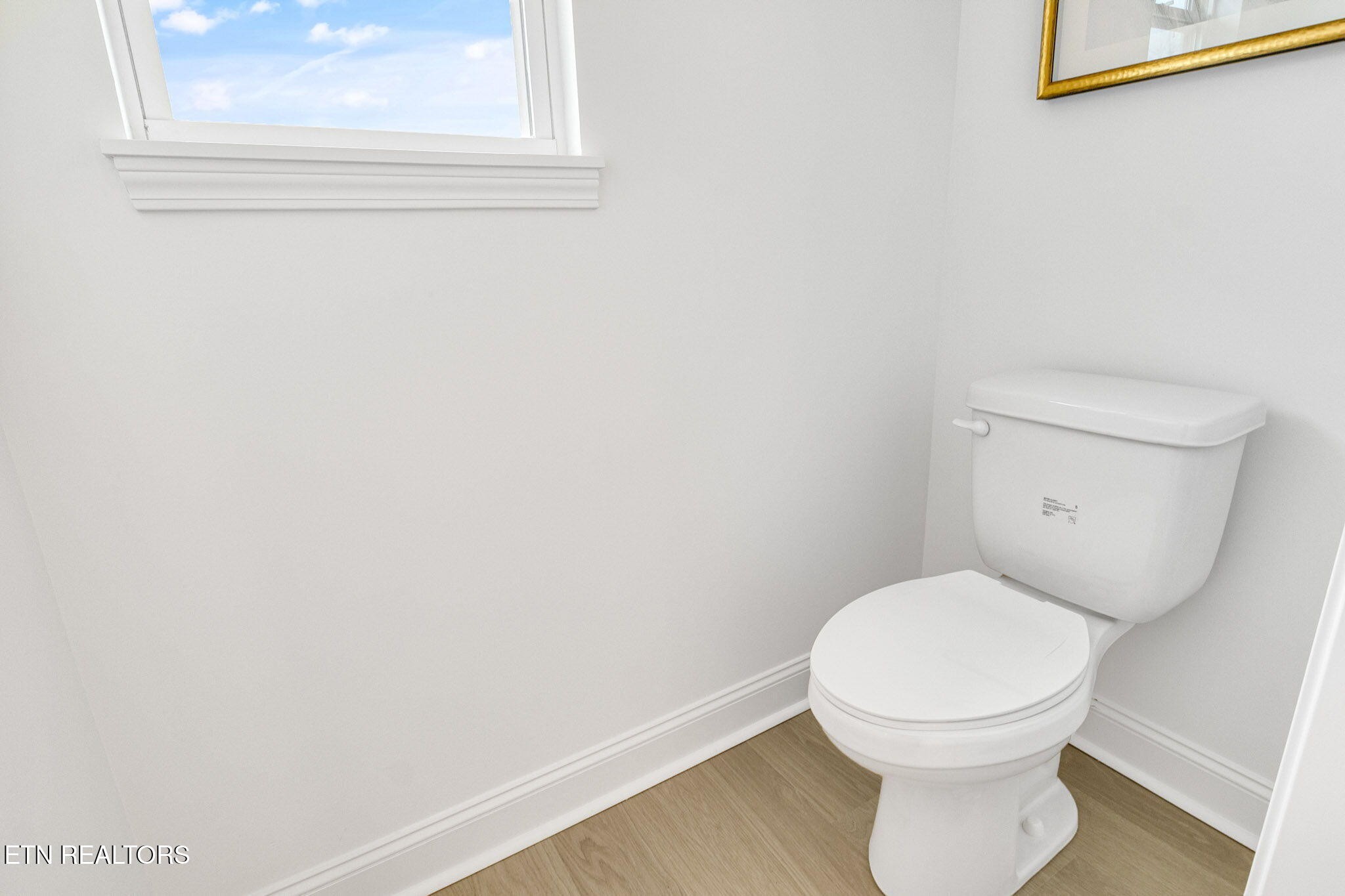 8418 Whisper Lane Powell, TN 37849 - Photo 24 of 42 a white toilet sitting next to a window