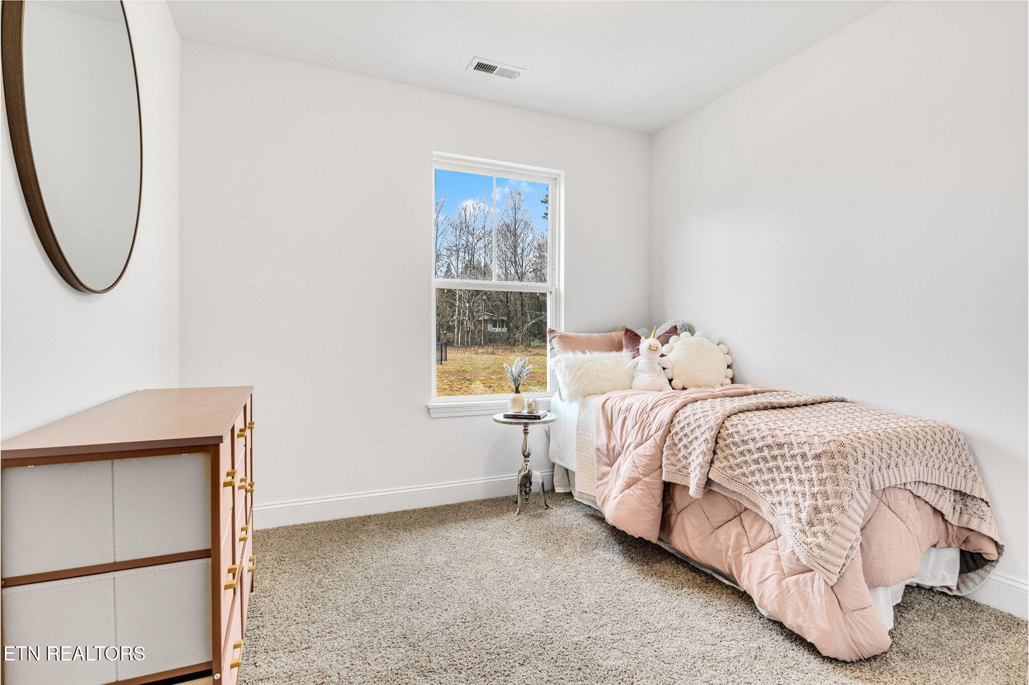 8418 Whisper Lane Powell, TN 37849 - Photo 25 of 42 a bedroom with a bed and a window