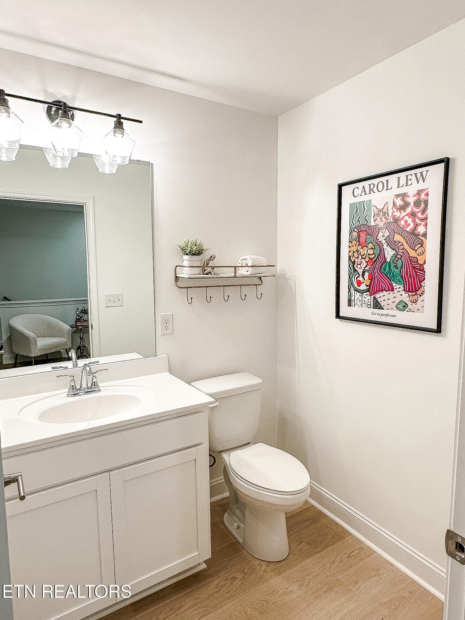 8418 Whisper Lane Powell, TN 37849 - Photo 28 of 42 a bathroom with a toilet a sink and mirror