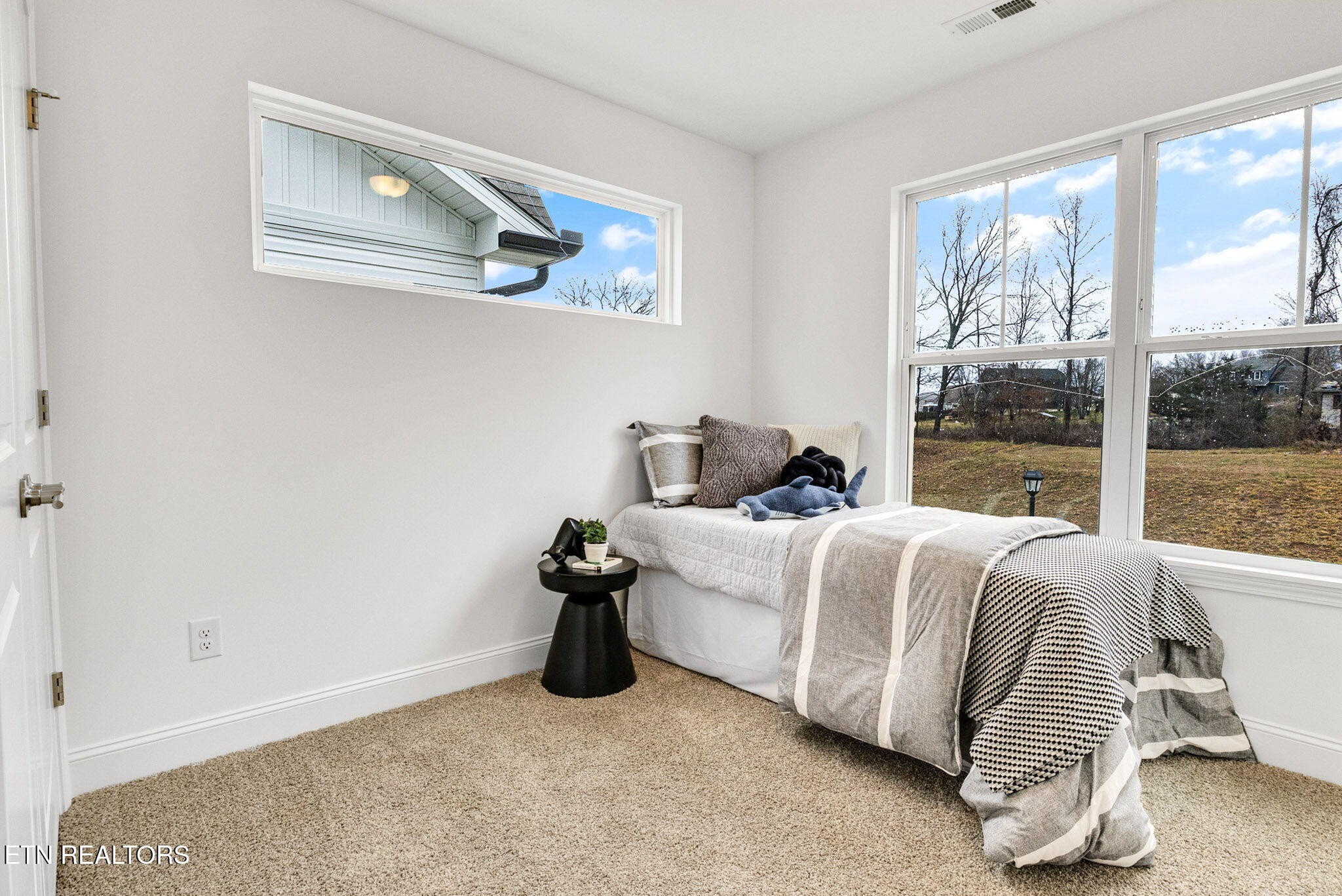 8418 Whisper Lane Powell, TN 37849 - Photo 29 of 42 a bedroom with a bed and window