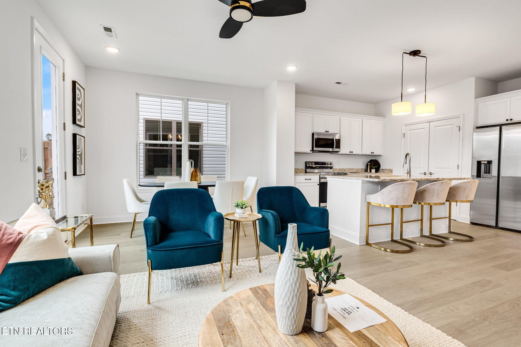 8418 Whisper Lane Powell, TN 37849 - Photo 5 of 42 a living room with furniture and a chandelier