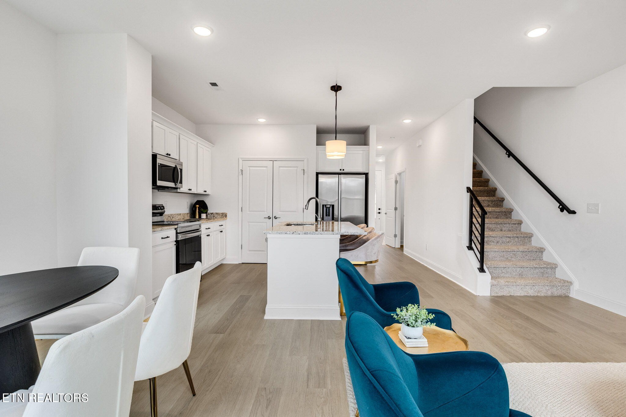 8418 Whisper Lane Powell, TN 37849 - Photo 6 of 42 a living room with furniture kitchen and a wooden floor