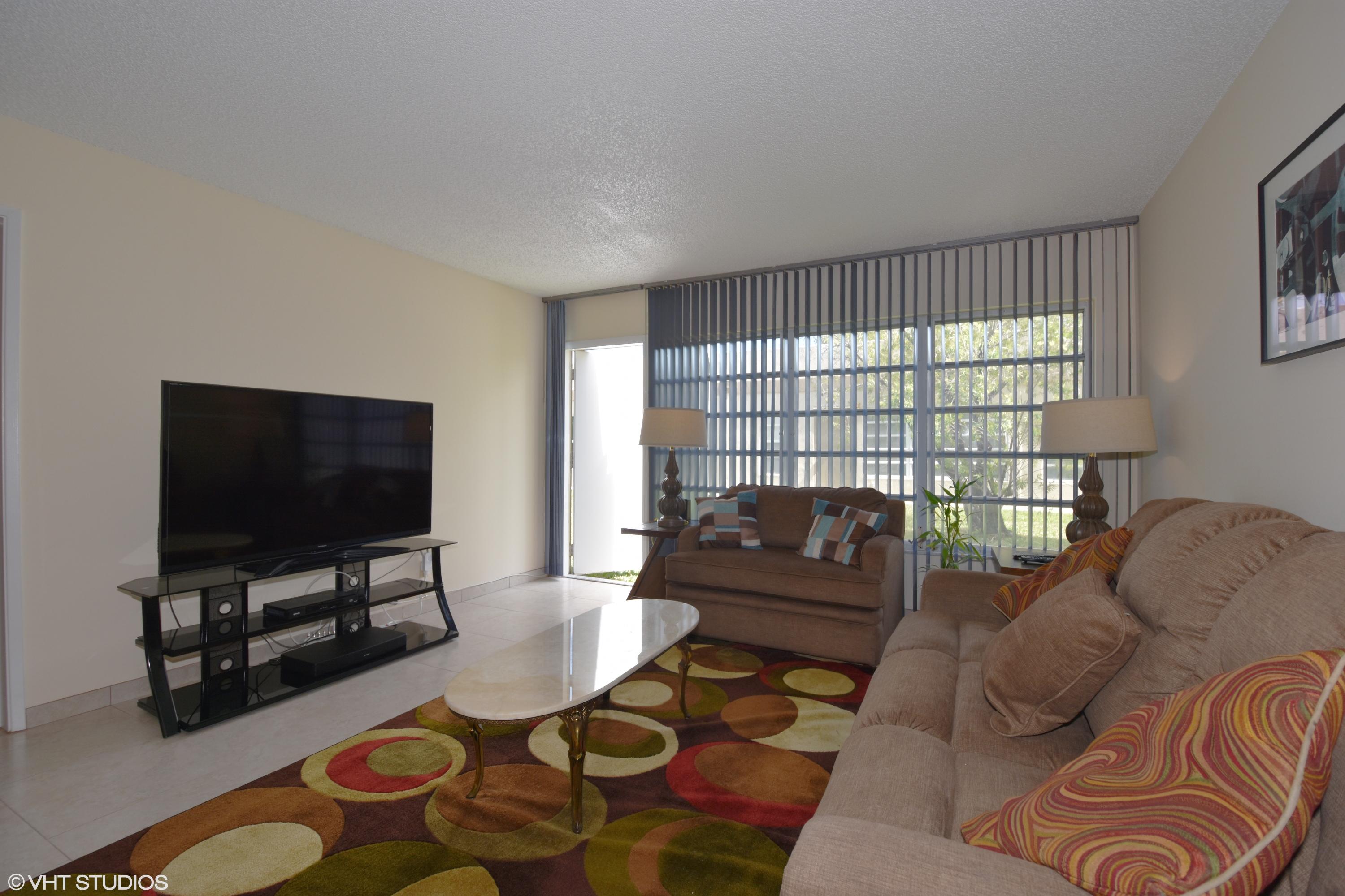 18820 Stewart Circle, Unit 4 Boca Raton, FL 33496 - Photo 11 of 27 02_18820StewartCir_Apt4_165_LivingRoom_H