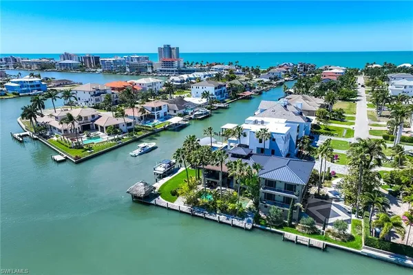 an aerial view of a house with a garden lake view
