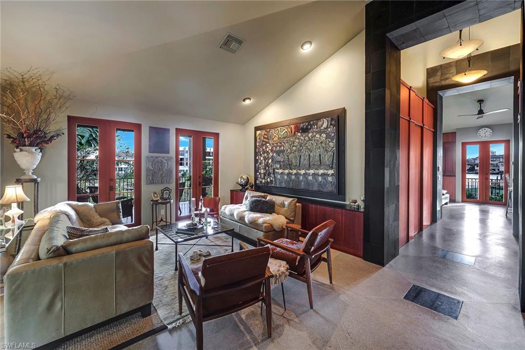 290 Channel Drive Naples, FL 34108 - Photo 16 of 49 a living room with furniture and a flat screen tv