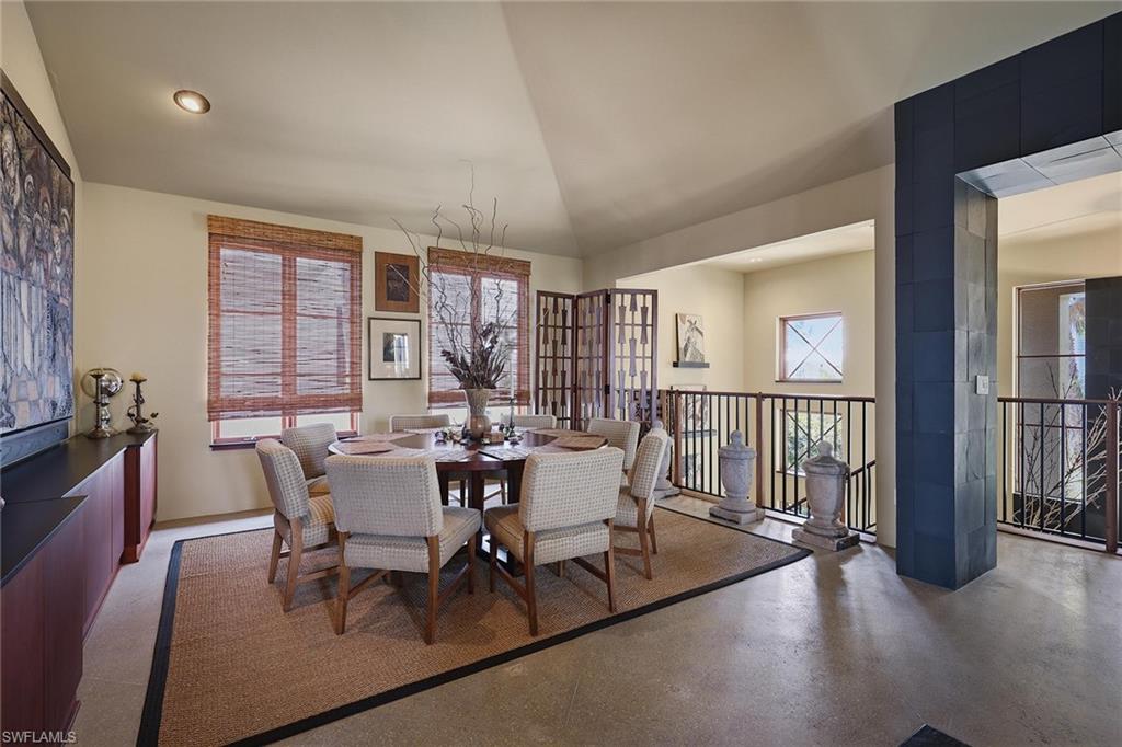 290 Channel Drive Naples, FL 34108 - Photo 18 of 45 a view of a dining room with furniture window and wooden floor