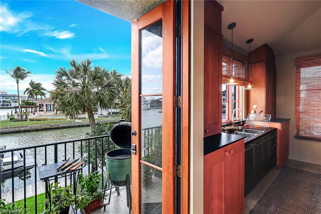 290 Channel Drive Naples, FL 34108 - Photo 19 of 49 a view of a balcony and front door