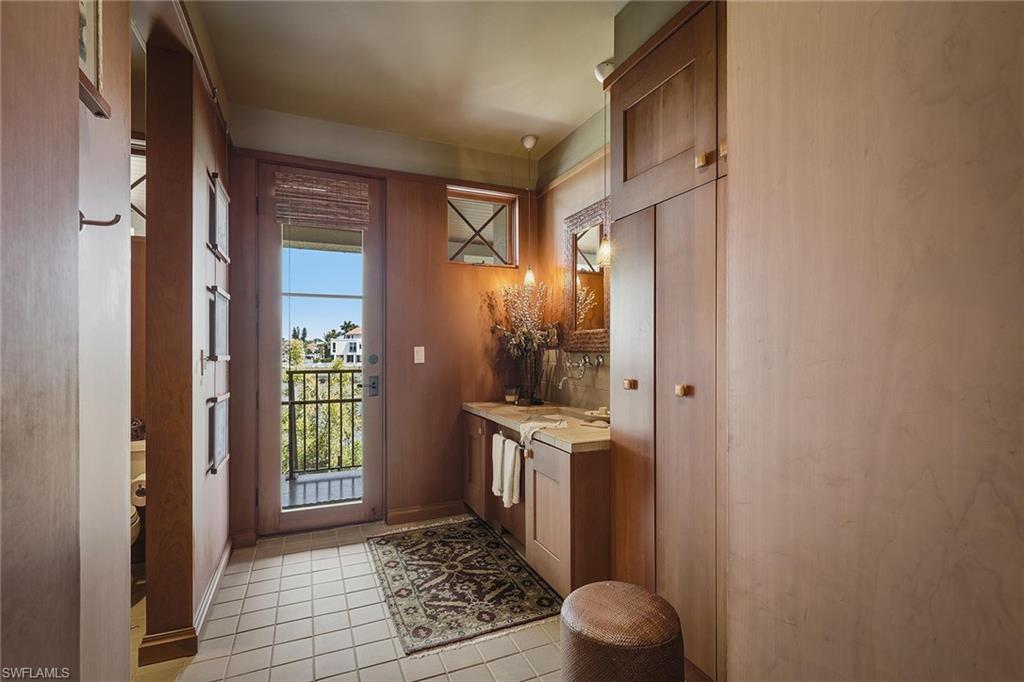 290 Channel Drive Naples, FL 34108 - Photo 20 of 45 a view of a hallway with front door
