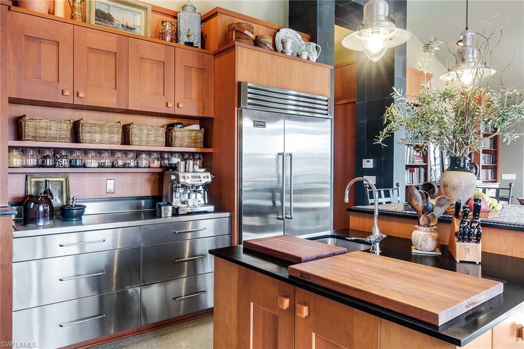 290 Channel Drive Naples, FL 34108 - Photo 21 of 49 a kitchen with stainless steel appliances granite countertop a stove a sink and dishwasher