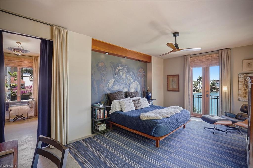 290 Channel Drive Naples, FL 34108 - Photo 31 of 45 a bedroom with a bed wooden floor and table