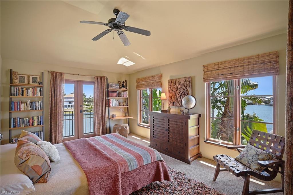 290 Channel Drive Naples, FL 34108 - Photo 34 of 45 a bedroom with a bed dresser and a window