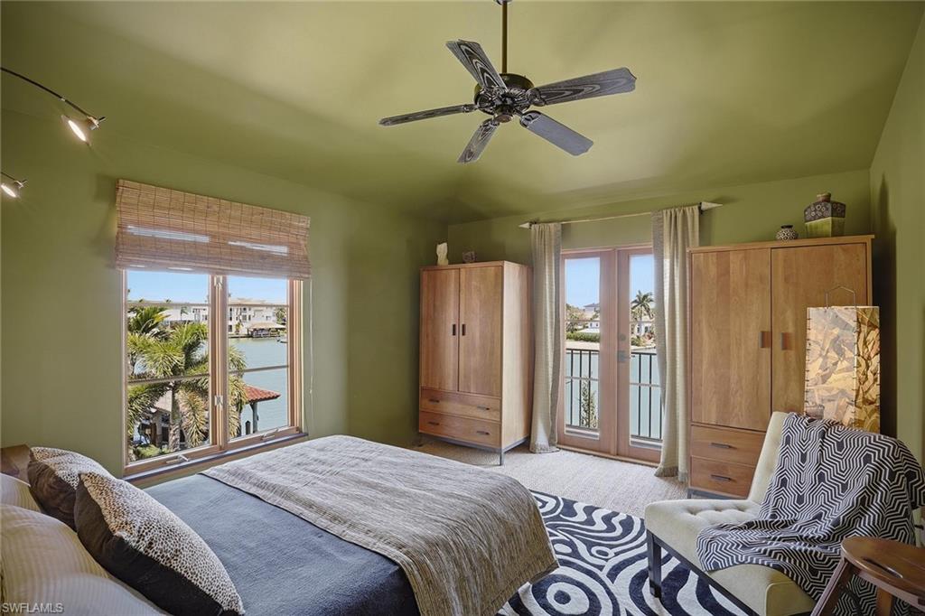 290 Channel Drive Naples, FL 34108 - Photo 35 of 45 a bedroom with a bed furniture and a window