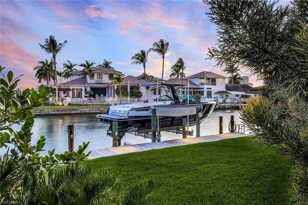 290 Channel Drive Naples, FL 34108 - Photo 43 of 49 a view of a house with pool porch and sitting area
