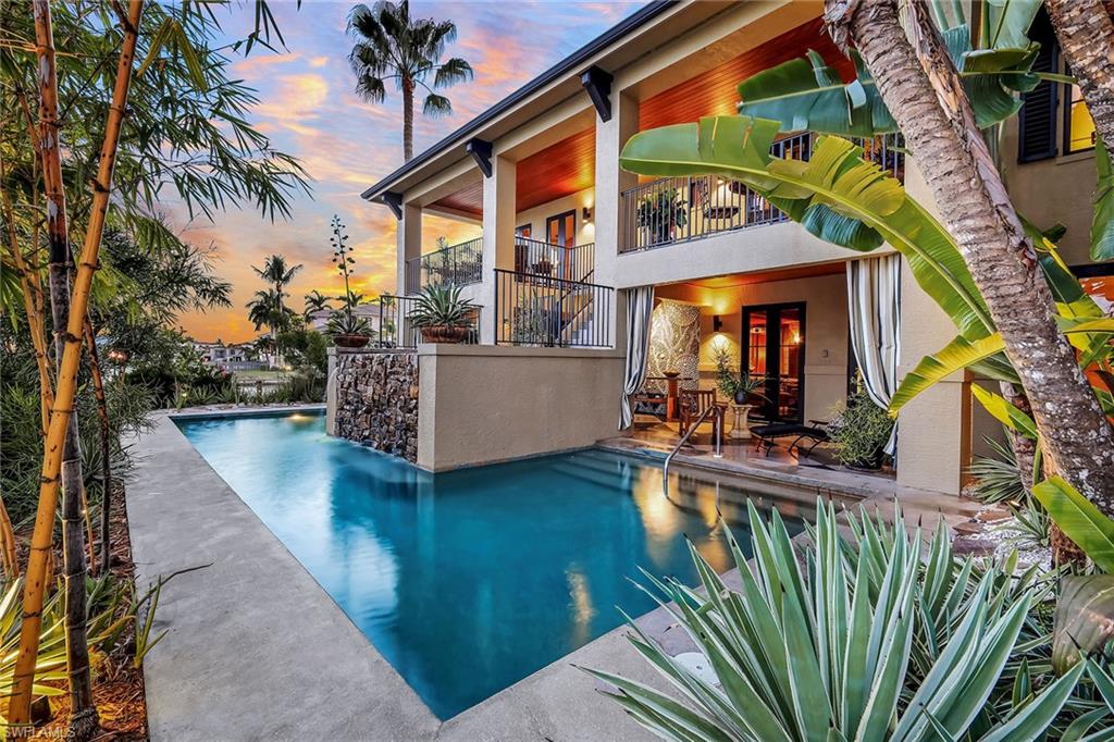 290 Channel Drive Naples, FL 34108 - Photo 6 of 49 a view of a house with backyard and sitting area