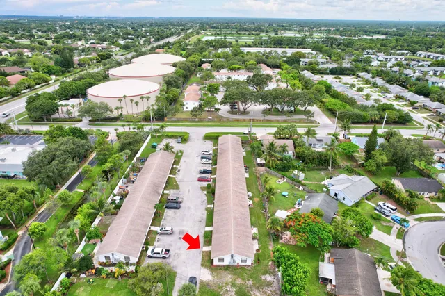 an aerial view of residential houses with outdoor space