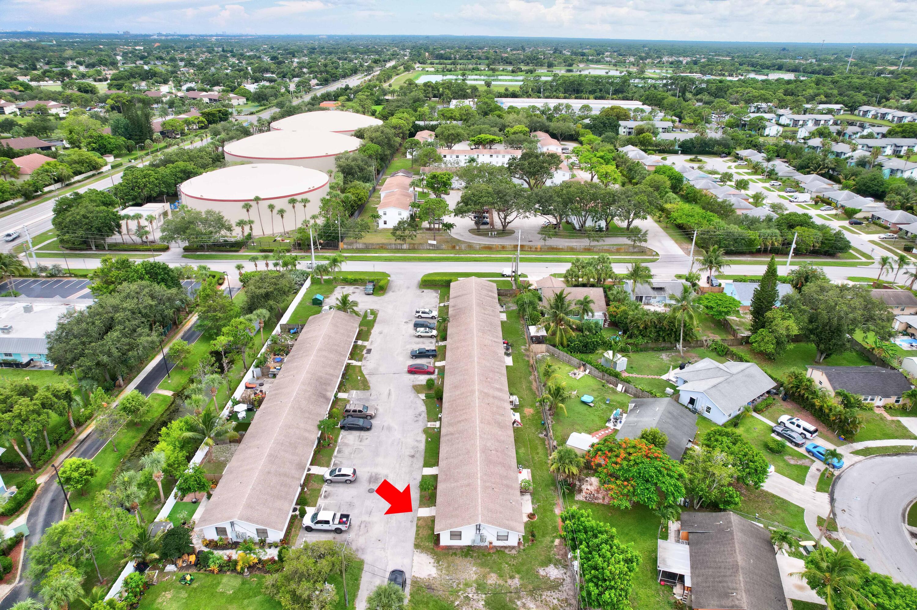 6567 Jupiter Gardens Boulevard, Unit 7 Jupiter, FL 33458 - Photo 4 of 20 an aerial view of residential houses with outdoor space