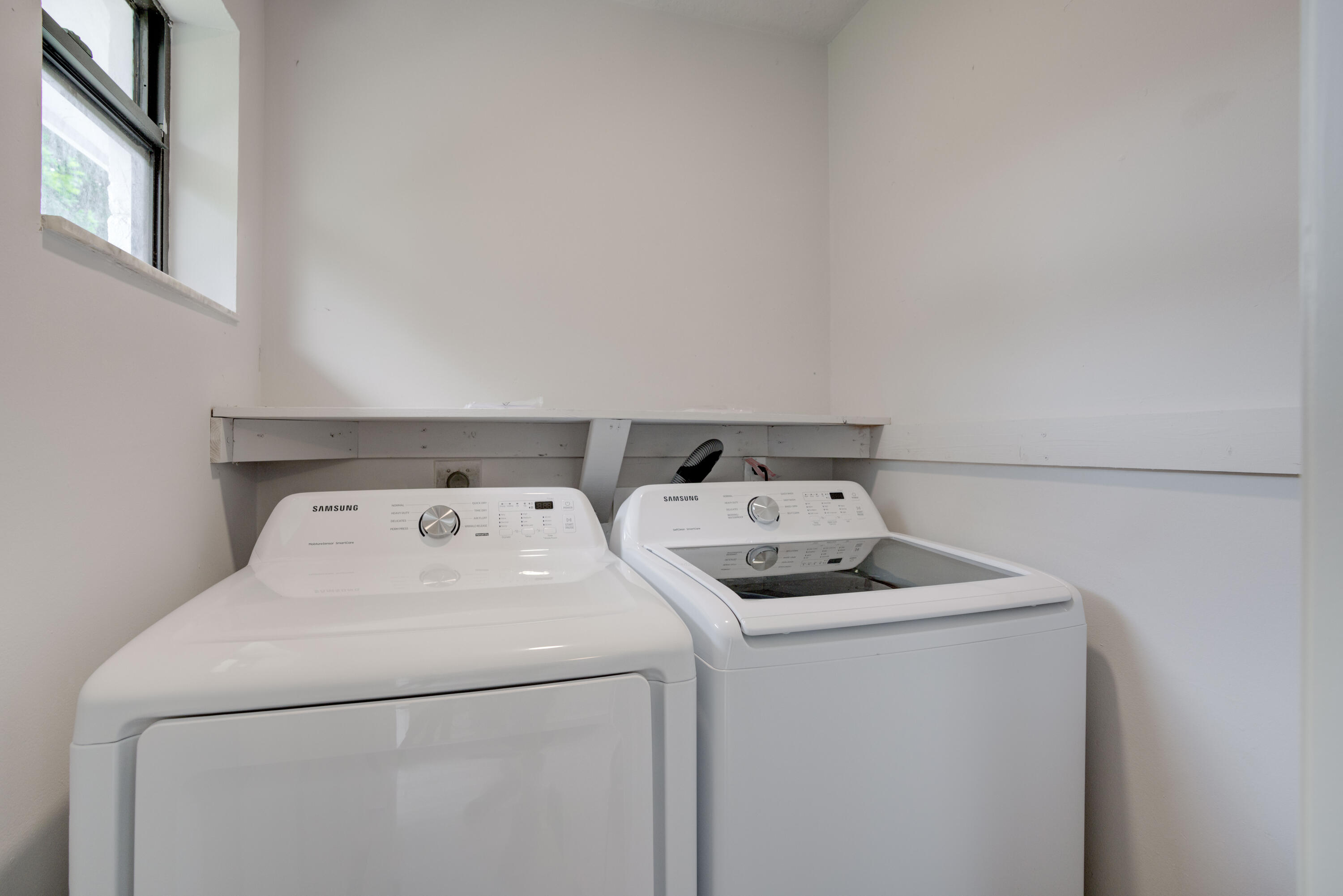 6567 Jupiter Gardens Boulevard, Unit 7 Jupiter, FL 33458 - Photo 6 of 20 a utility room with dryer and washer