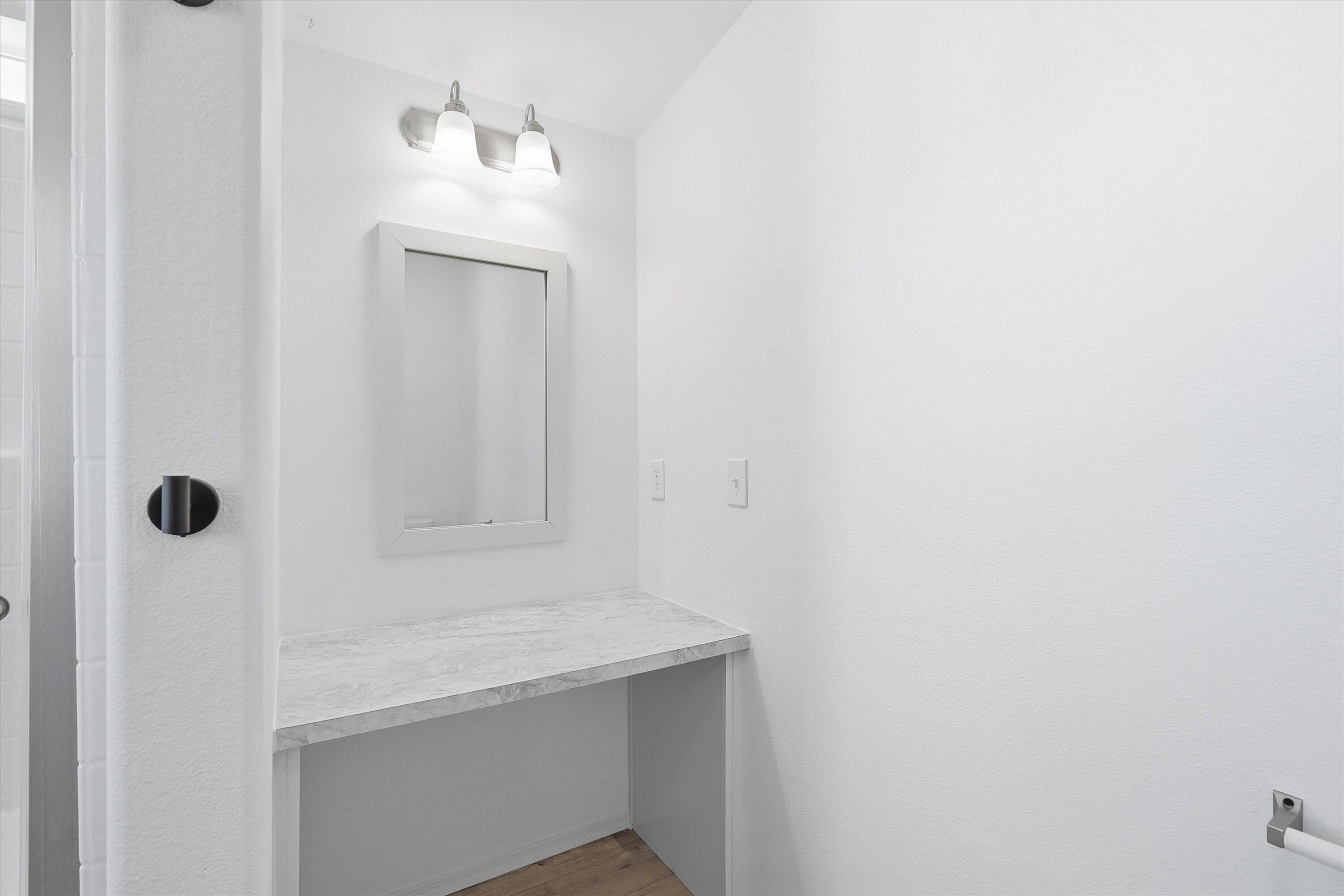 300 Luman Road, Unit 197 Phoenix, OR 97535 - Photo 21 of 26 a bathroom with a sink a mirror and shower