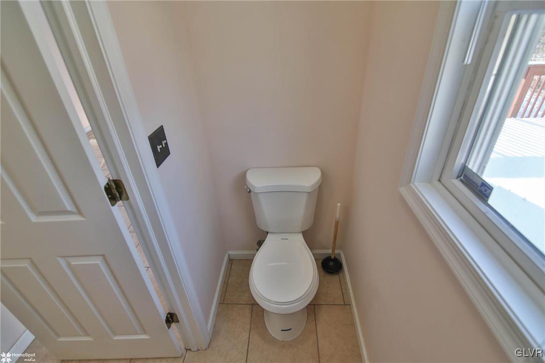 185 Sunset Road East Stroudsburg, PA 18302 - Photo 24 of 49 a bathroom with a toilet and a large window
