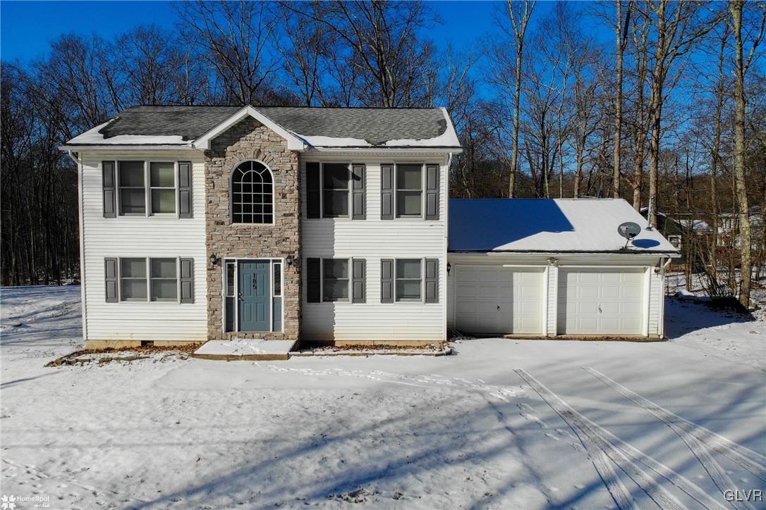 185 Sunset Road East Stroudsburg, PA 18302 - Photo 3 of 49 a front view of a house with a yard