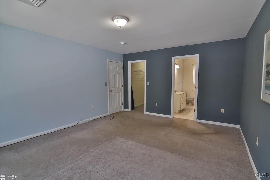 185 Sunset Road East Stroudsburg, PA 18302 - Photo 33 of 49 an empty room with closet and wooden door