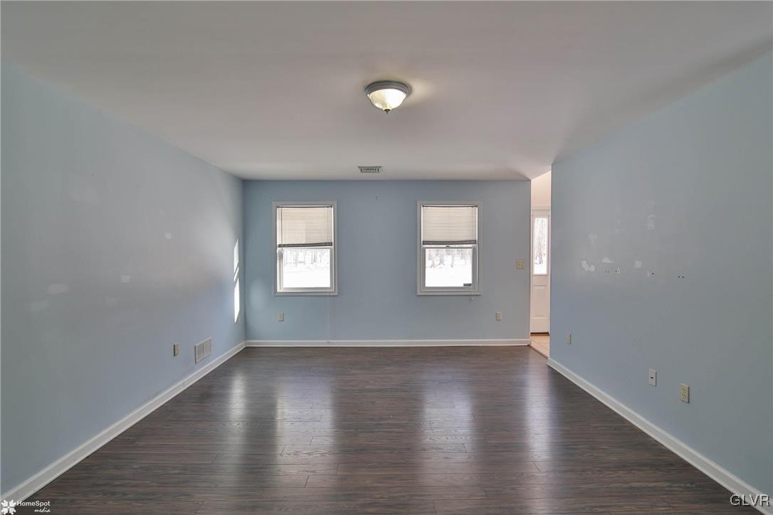 185 Sunset Road East Stroudsburg, PA 18302 - Photo 10 of 49 an empty room with wooden floor and windows