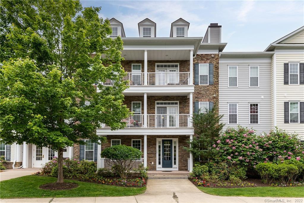1 Rivington Road, Unit 106 Danbury, CT 06810 - Photo 1 of 1 a front view of a house with a garden