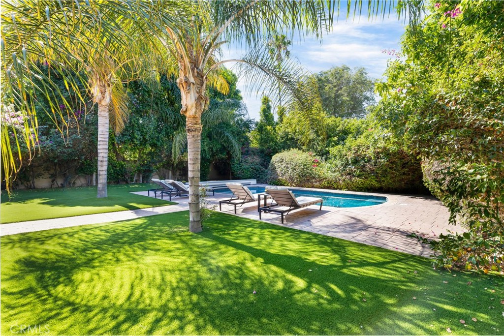 16659 Addison Street Encino, CA 91436 - Photo 41 of 48 a view of a backyard with swimming pool