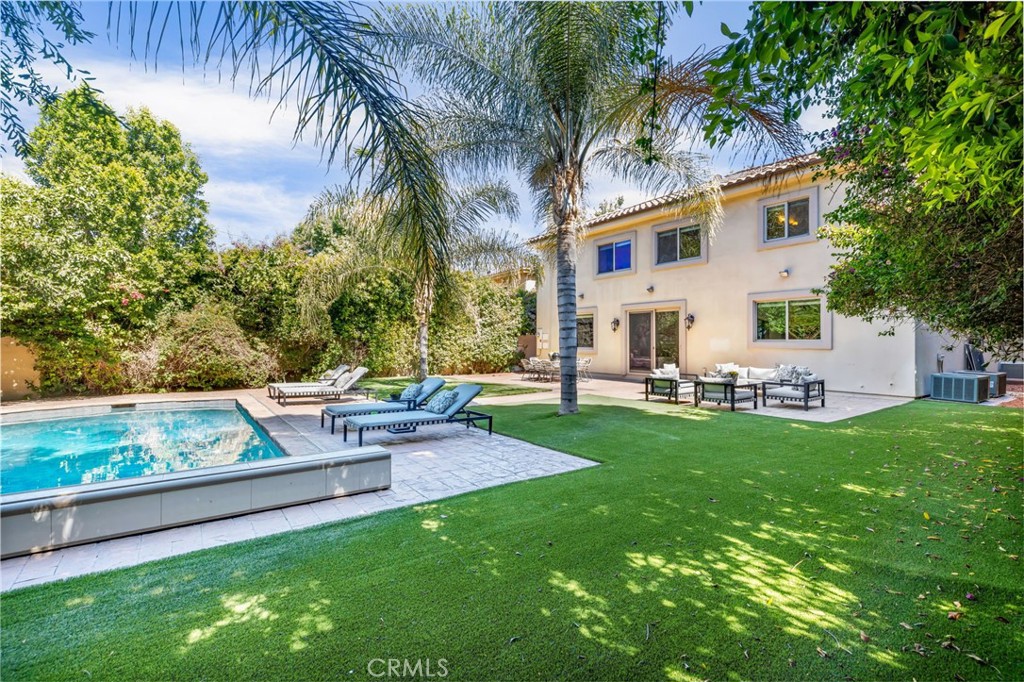 16659 Addison Street Encino, CA 91436 - Photo 44 of 48 a view of backyard of house with green space