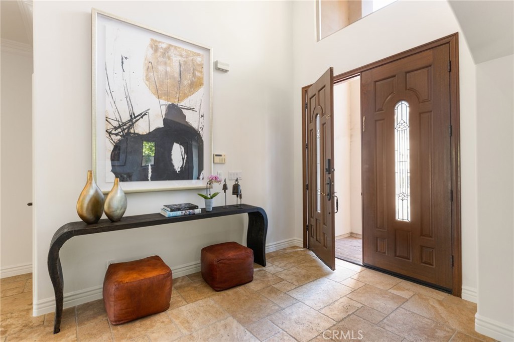 16659 Addison Street Encino, CA 91436 - Photo 6 of 48 a room with furniture and mirror